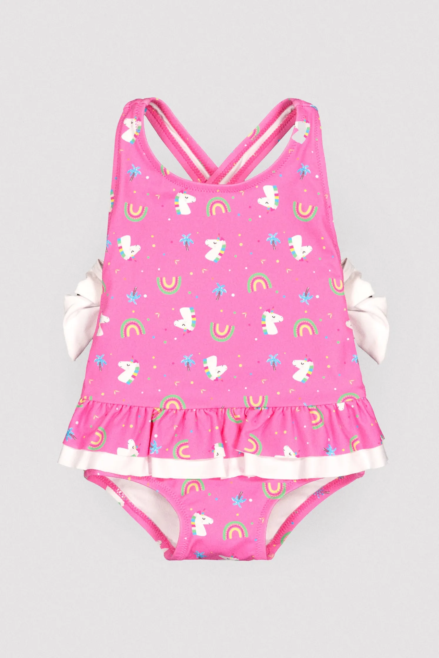 Bañador bebé niña detalles volantes y lazos estampado unicornios rosa