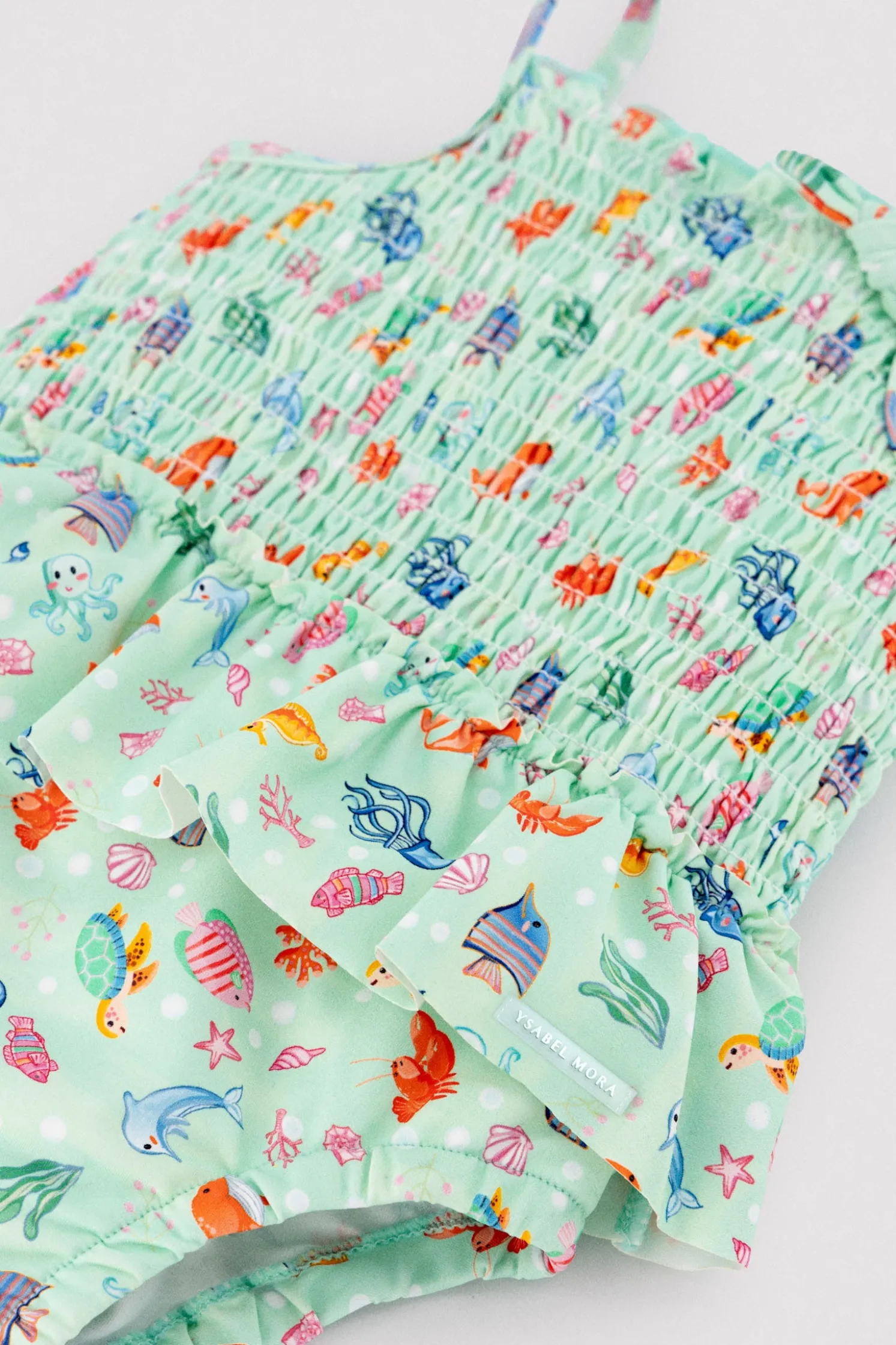 Bañador bebé niña detalle volante y nido de abeja estampado fauna marina