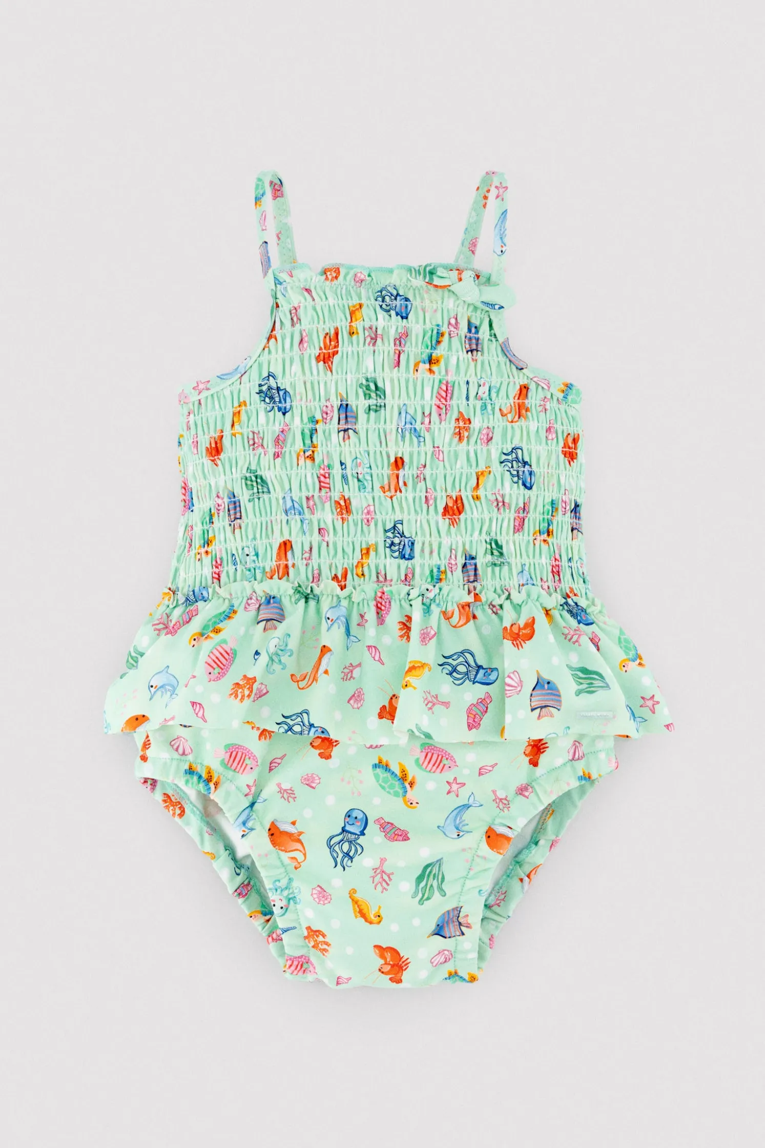 Bañador bebé niña detalle volante y nido de abeja estampado fauna marina