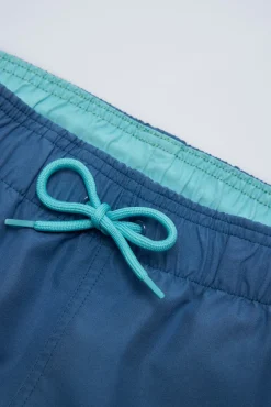 Bañador juvenil corto estampado liso azul