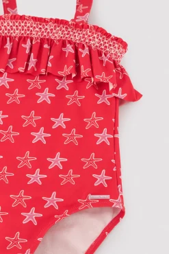 Bañador niña detalle volante estampado estrellas marinas rojo