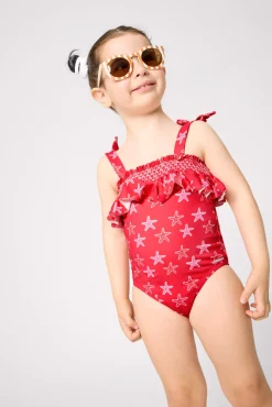 Bañador niña detalle volante estampado estrellas marinas rojo