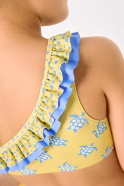 Bikini niña asimétrico detalle volantes estampado tortugas amarillo