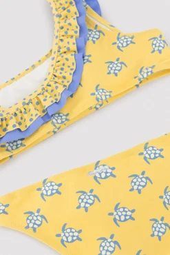 Bikini niña asimétrico detalle volantes estampado tortugas amarillo