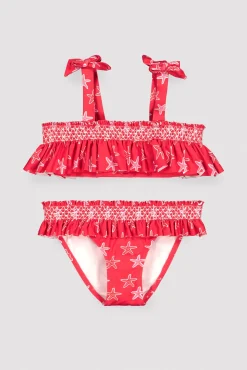 Bikini niña detalles volantes y nido de abeja estampado estrellas marinas rojo