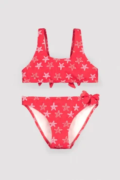 Bikini niña detalles volantes y lazos estampado estrellas marinas rojo