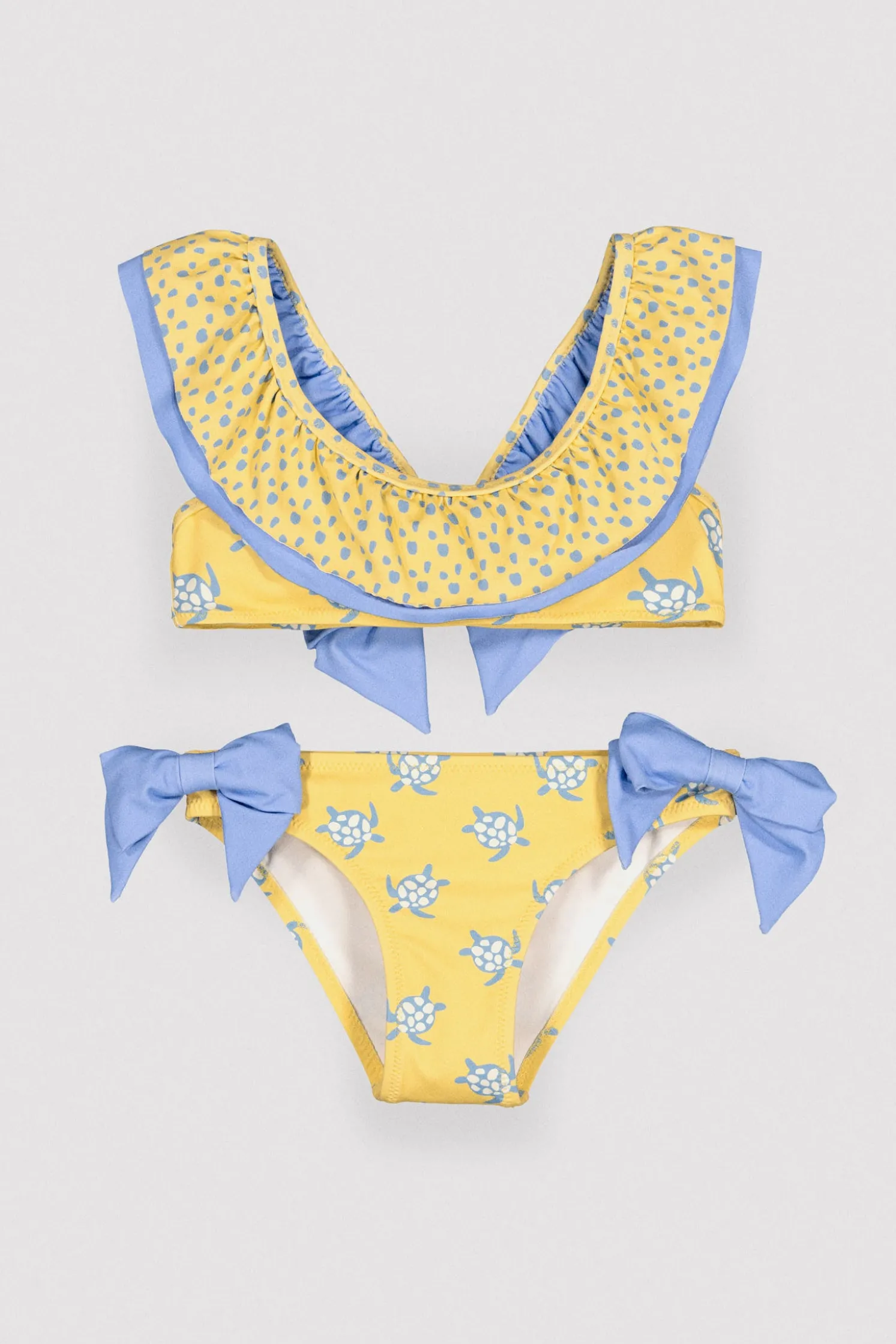 Bikini niña detalle volante y lazos estampado tortugas amarillo
