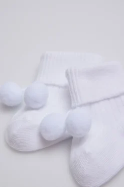 Calcetines canalé con borlas recién nacido blanco