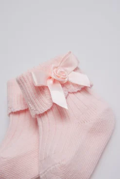 Calcetines canalé con lazo recién nacido rosa