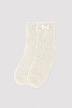Calcetines infantiles calados detalle lazo marfil