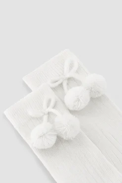 Calcetines largos pompones blanco