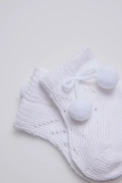 Calcetines perlé con borlas recién nacido blanco
