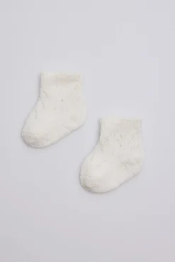 Calcetines perlé recién nacido marfil