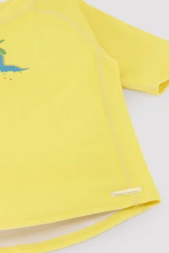 Camiseta de baño bebé dibujo dinosaurio y palmera amarillo