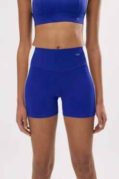 Leggings deportivos cortos efecto push-up azul índigo con franja en contraste