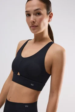 Sujetador deportivo compressive detalle abertura sujeción media negro